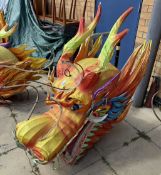 7 Large carnival dragon heads. 128cm height approximately.