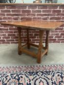 A Colin Almack Beaverman oak drop leaf coffee table with rotating top.