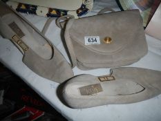 A pair of vintage Lotus shoes with matching handbag.