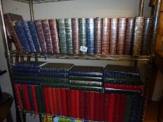 A large collection of Readers Digest books (two shelves).