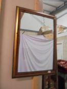 An ornate framed mirror.