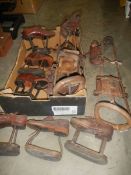 A box of early 20th century raised shoes and other walking aids.