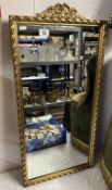 A gilt framed hall mirror