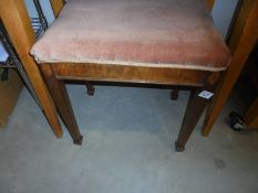 An Edwardian mahogany inlaid stool.