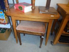 A light oak fold over tea/games table.