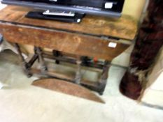 An early 20th century oak gateleg table for restoration.