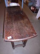 An oak barley twist gate leg table.