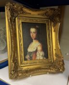 A gilt framed enhanced print of a portrait
