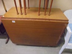 A drop leaf dining table.
