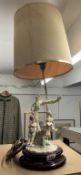 A good table lamp with children on swing base.