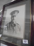 An old framed and glazed protrait of a military gentleman.