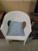 A Lloyd Loom style chair.