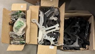 3 boxes of plate stands/hangers