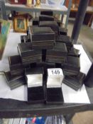 Approximately forty ring boxes.
