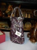 A lovely glass handbag in purple.