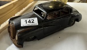 A vintage West German tinplate Mercedes 300 by JNF. Length 32.5cm