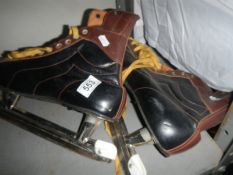 A pair of mid 20th century ice skates.