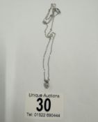 A 14ct white gold diamond pendant necklace of 35 points (1.3 grams)