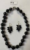 A Whitby jet necklace together with similar ear pendants