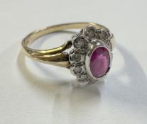 A Diamond and ruby cluster ring in a gold mount