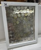 A framed collage of 50p pieces & £2 pieces (Over £60 of value)