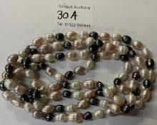 A long cultured pearl necklace in tones of pink white and grey (120cm) long