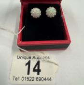 A pair of silver & opal stud earrings