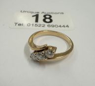 A yellow gold three stone diamond ring 60 points approximately ( 3 grams)