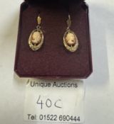 A pair of vintage cameo ear pendants textured gold mounts, female profiles in 9ct gold