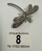 A silver dragon fly brooch inset with ruby & emeralds 15.9 grams