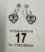 A pair of silver heart shaped earrings 2.9 grams