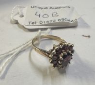 A vintage rich red garnet stone set ring claw set all gold