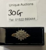 A Diamond cluster ring gold mount in 9ct 33ct textured gold shoulder