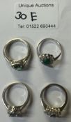4 Silver rings set with coloured stones