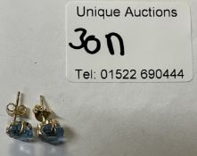 Pair of 9ct gold ear studs blue stone