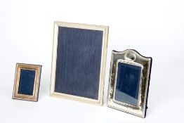 Three silver photo frames