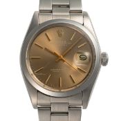 A GENTLEMAN'S SIZE STAINLESS STEEL ROLEX OYSTER PERPETUAL DATE WRIST WATCH CIRCA 1972, REF. 1500