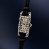 A FINE & RARE LADY'S PLATINUM & DIAMOND CARTIER TANK COCKTAIL WRIST WATCH CIRCA 1930s, WITH ORIGINAL