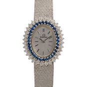 A LADY'S FINE 18K SOLID WHITE GOLD, DIAMOND & SAPPHIRE OMEGA BRACELET WATCH CIRCA 1970s, WITH