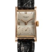A FINE GENTLEMAN'S SIZE 18K SOLID ROSE GOLD PATEK PHILIPPE RECTANGULAR WRIST WATCH DATED 1953,