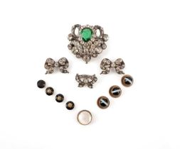 Four paste brooches and seven studs, comprising: three paste bow brooches and a white and green