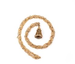 A gold long chain and fob seal, the chain of fancy linking suspends a fob seal set with a smoky