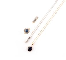 A collection of jewellery, comprising: a sapphire and diamond cluster ring, the cushion-cut sapphire