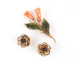 λ A coral, hardstone and diamond brooch and a pair of sapphire stud earrings, the brooch designed as