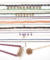 λ A collection of necklaces, comprising: two Indian necklaces, one with a central section of rubies,