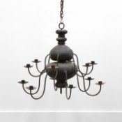 A Swedish vernacular patinated metal twelve-branch chandelier,