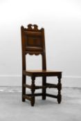 A late 17th-century oak hall chair,