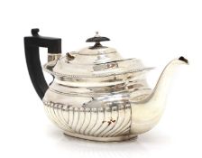 A silver teapot,