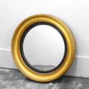 A Regency giltwood convex wall mirror,
