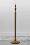 A walnut standard lamp,